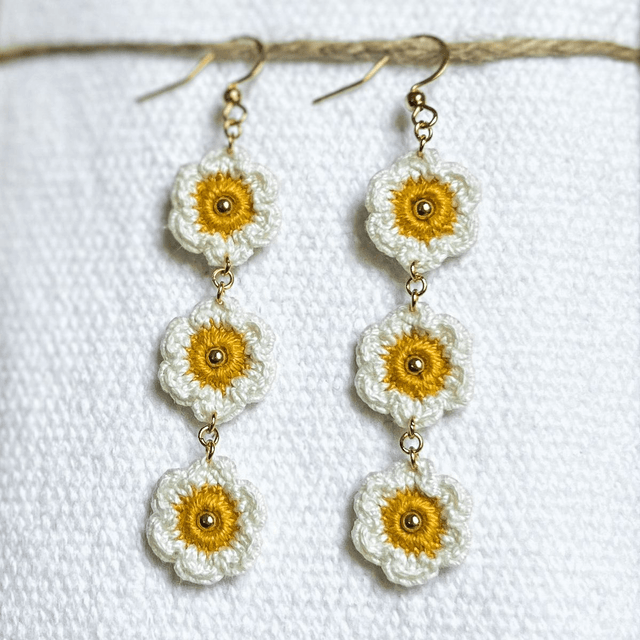 Longues boucles d’oreilles pâquerettes